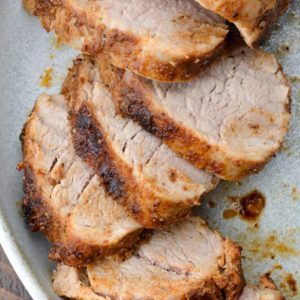 This easy Smoked Pork Tenderloin is flavored with the most amazing homemade dry rub, then slow cooker to perfection on the grill!