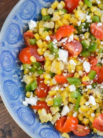 Make this Corn and Tomato Salad recipe for your next potluck or BBQ. It's a quick and easy summer side dish that everyone loves!