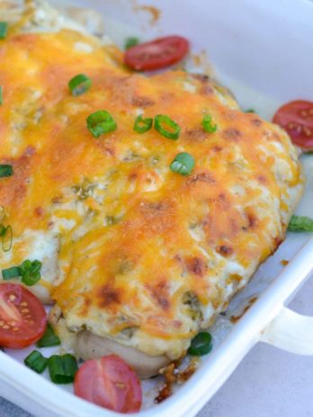 Try my favorite Cheesy Chicken Bake for an easy one pan, keto-friendly dinner recipe! Each serving of chicken is smothered with green chiles, cheese and ranch for less than 4 net carbs! 