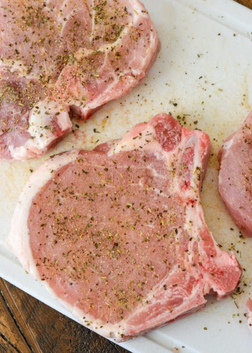 bone-in pork chops seasoned with Italian seasoning, salt, pepper, and more