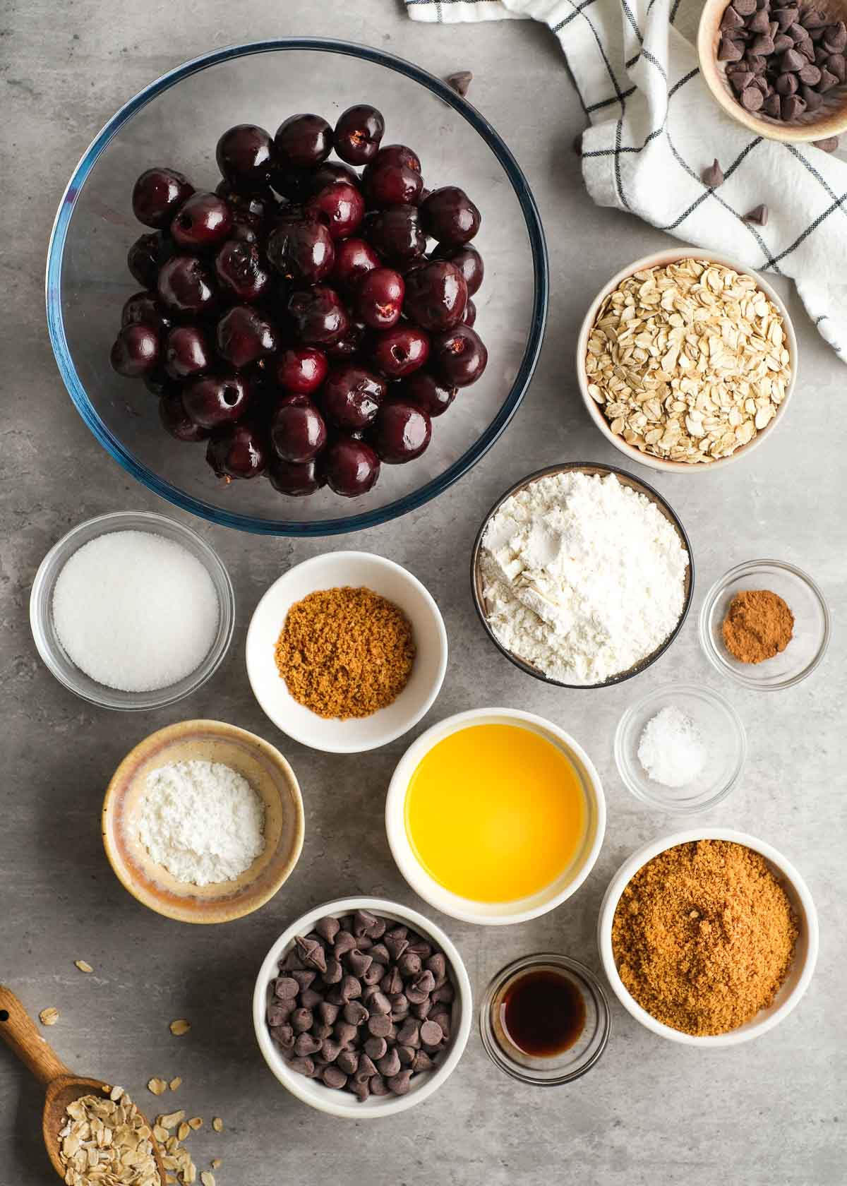 ingredients for chocolate cherry crisp in glass bowls
