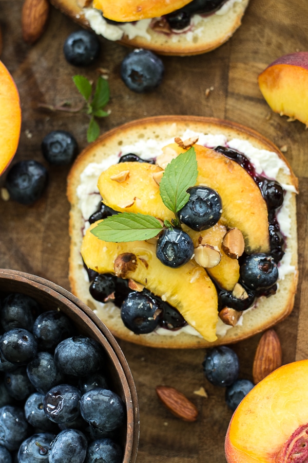 This simple Sweet Peach Bruschetta combine the best flavors of Summer! Fresh peaches, blueberries and mint make for an impressive combination! 