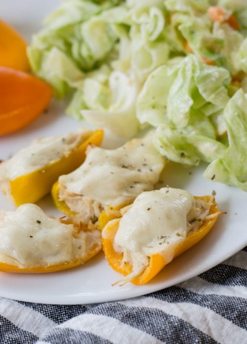 mini sweet peppers filled with ranch chicken and topped with cheese for an easy keto lunch