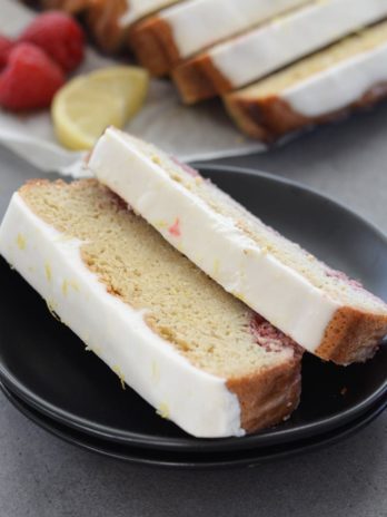 Enjoy a slice of Keto Lemon Raspberry Bread topped with Lemon Cream Cheese Glaze for under 3 net carbs per slice!