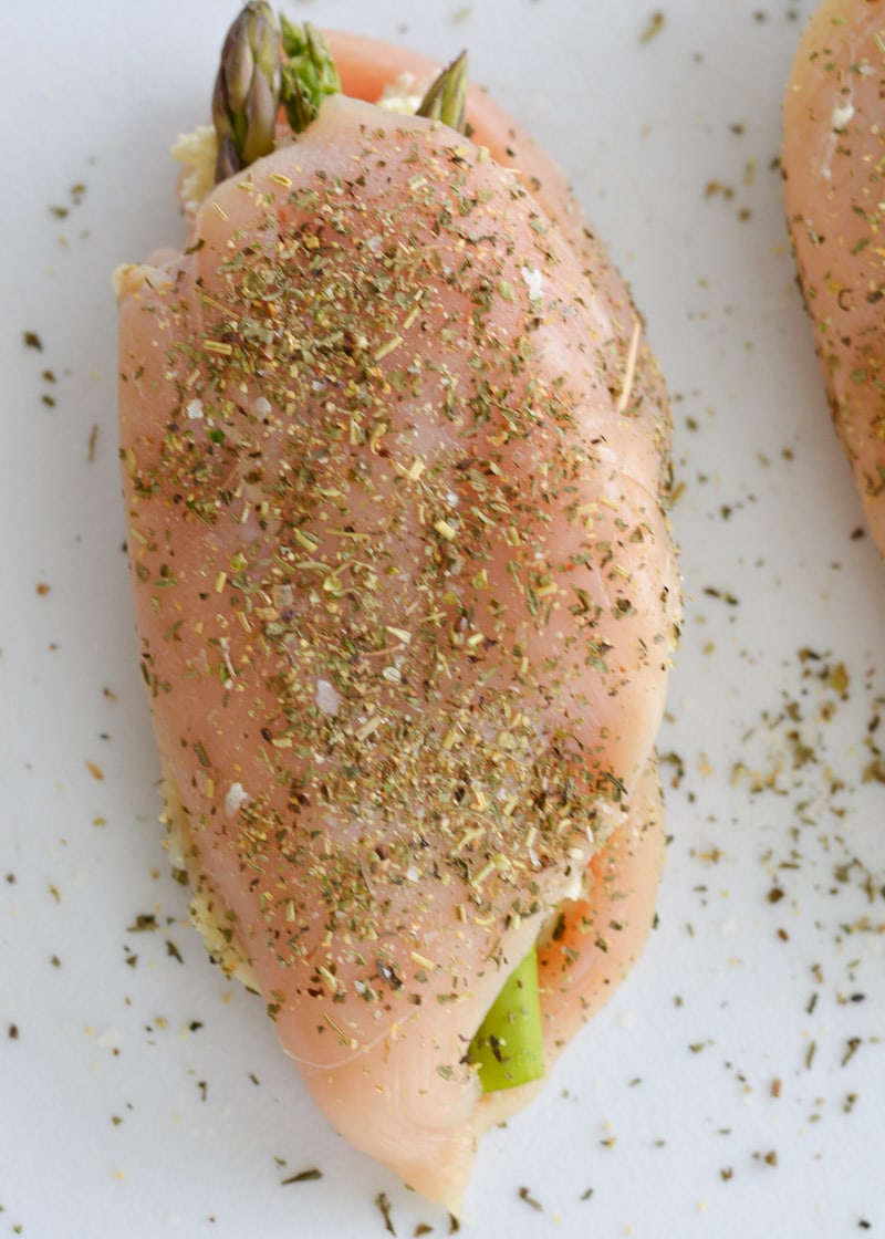 This Asparagus Stuffed Chicken is loaded with two kinds of cheese, tender asparagus and is rubbed with an Italian herb mix. This one pan, low carb recipe has about 2 net carbs per serving and is ready in 30 minutes. 