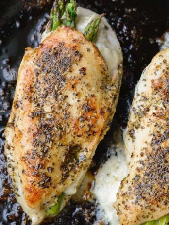 This Asparagus Stuffed Chicken is loaded with two kinds of cheese, tender asparagus and is rubbed with an Italian herb mix. This one pan, low carb recipe has about 2 net carbs per serving and is ready in 30 minutes. 