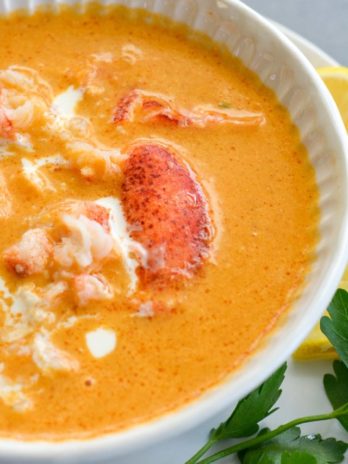 This creamy Lobster Bisque is a shortcut recipe that is low on carbs, but big on flavor! This 30 minute soup recipe features a savory broth and garlic butter lobster for a truly decadent meal! 