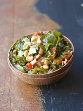 Crock Pot Black Eyed Peas and Collard Greens are the ultimate Southern comfort food! Tender greens, salty ham, and spicy jalapenos make the absolute best slow cooker meal.