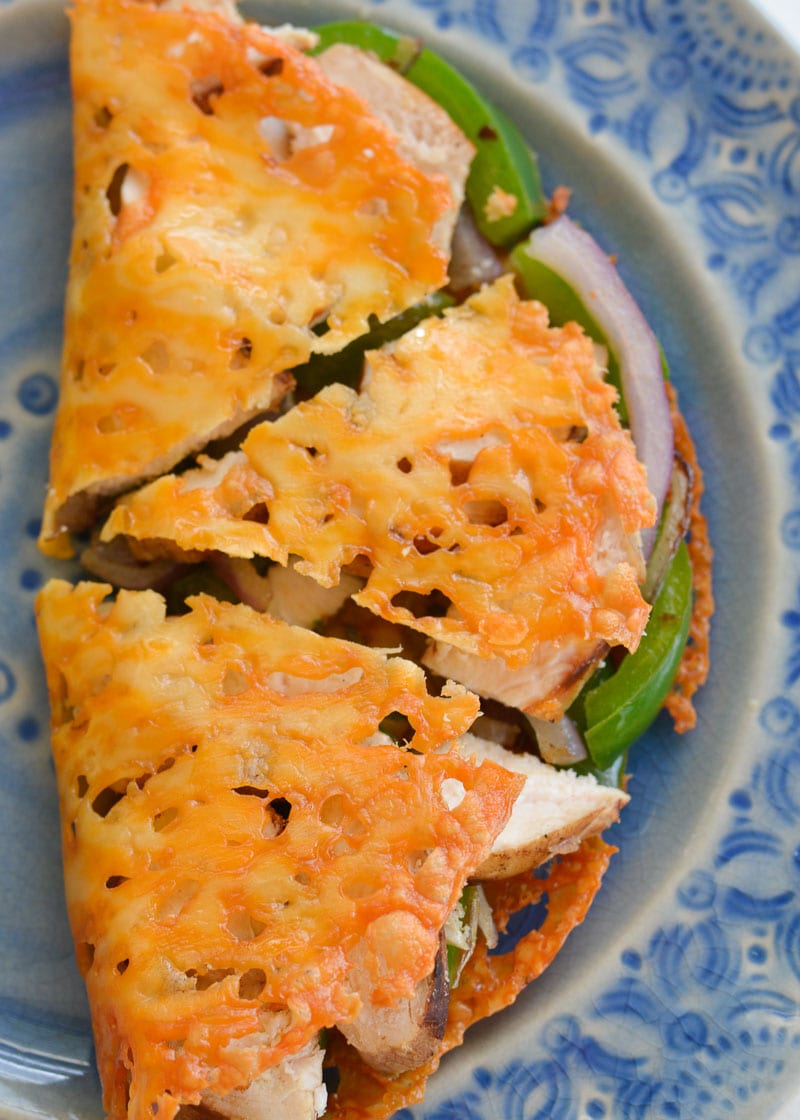 overhead shot showing a crisp, cheesy keto quesadilla shell filled with juicy grilled chicken and veggies