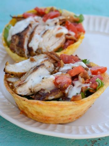 This Keto Salad Bowl is the perfect healthy lunch! Tender chicken is paired with greens, vegetables and ranch inside of a delicious chaffle bowl! Enjoy this keto meal at only 2.9 net carbs!