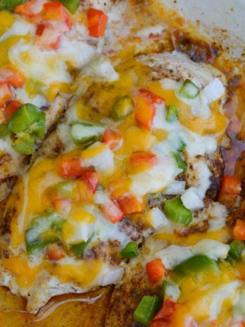 Seasoned chicken is smothered with peppers, onions and cheese in this easy Chicken Fajita Casserole! This keto meal is ready in 30 minutes and is under 4 net carbs!