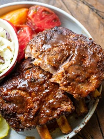 Try these ultra tender Crock Pot Ribs for the perfect easy meal! First ribs are seasoned with a smokey BBQ rub, cooked until super tender and then smothered in BBQ sauce and broiled to perfection! 