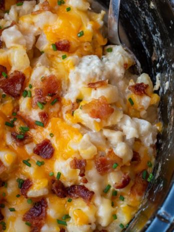 These Crockpot Cheesy Potatoes require a few basic ingredients and no prep! Simply dump the ingredients for these cheesy potatoes in a slow cooker, mix and forget it! This is the best side dish recipe!