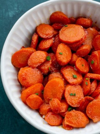 These easy Glazed Carrots require just 4 ingredients and are ready in about 15 minutes! This is the perfect holiday side dish that can be made ahead of time.