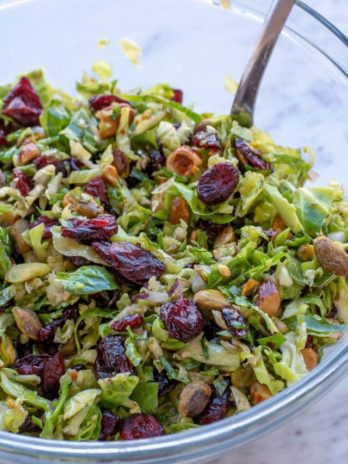 This Shaved Brussels Sprouts Salad is the best no-cook, meal prep dish! This healthy, easy salad is perfect for lunch, potlucks, holiday parties, and more!