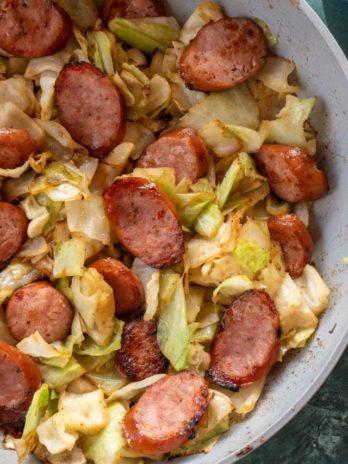 Need an easy low carb, one-pan dinner? I've got you covered! This Keto Sausage and Cabbage Skillet is ready in under 20 minutes and has less than 6 carbs per serving!