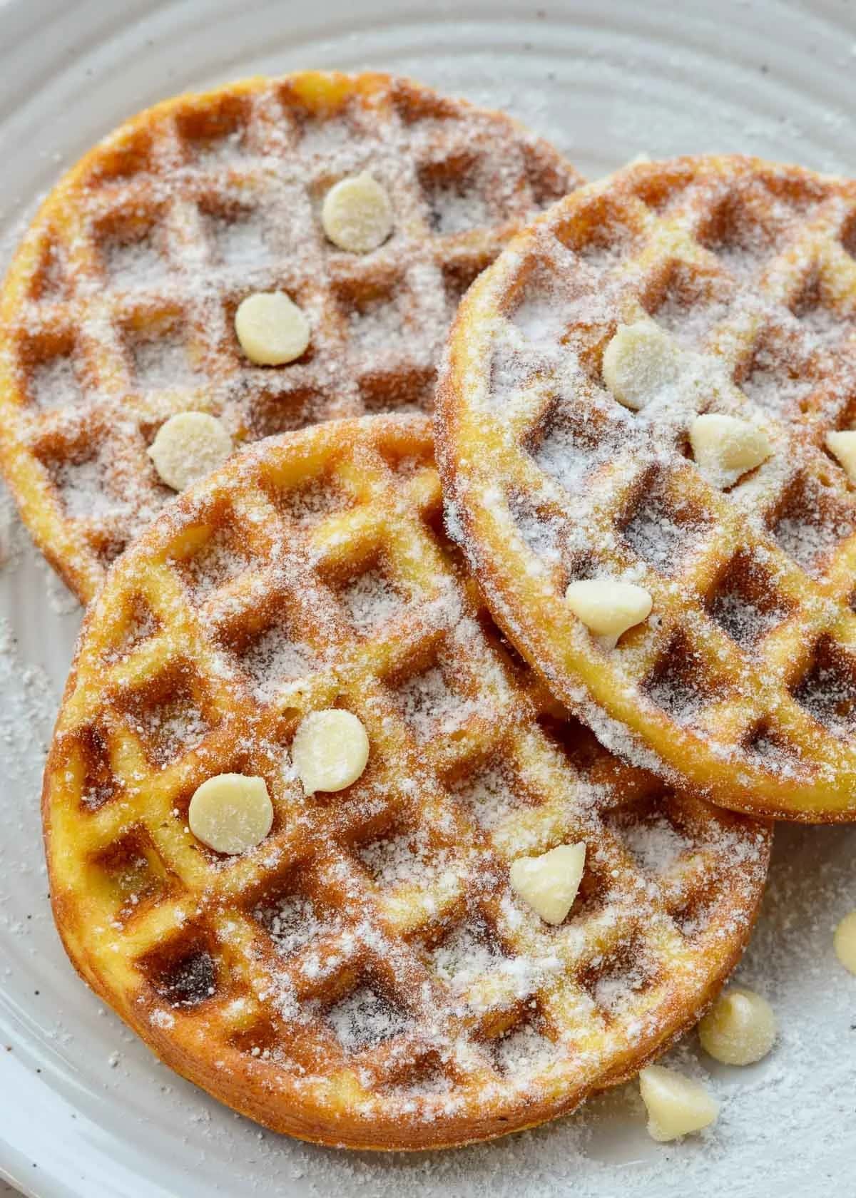 These Sweet Chaffles are perfect for a low-carb breakfast, snack, or dessert! Cheesy waffles are soft, fluffy, and packed with sugar-free white chocolate chips for a treat around 1 net carb each.