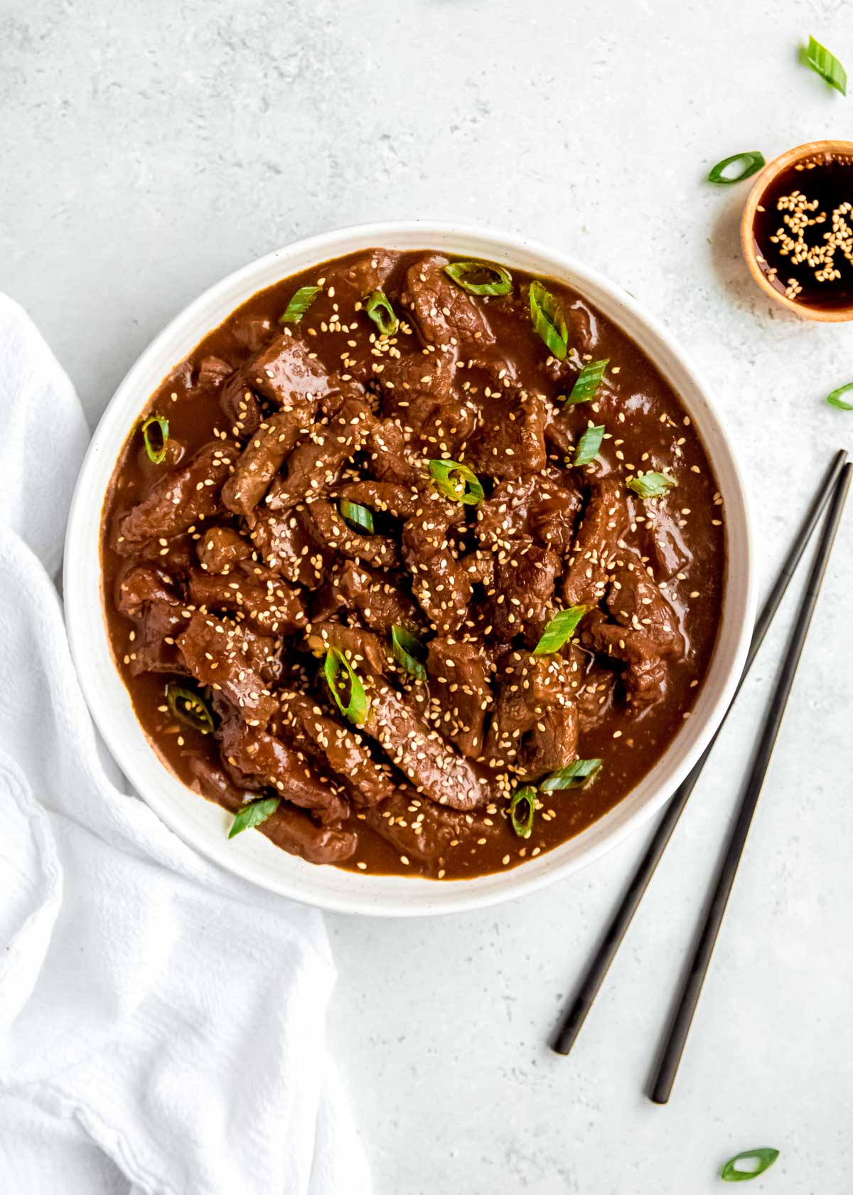 Mongolian Beef in bowl with chopsticks