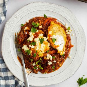 shakshuka on a plate with a fork