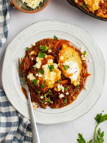 shakshuka on a plate with a fork