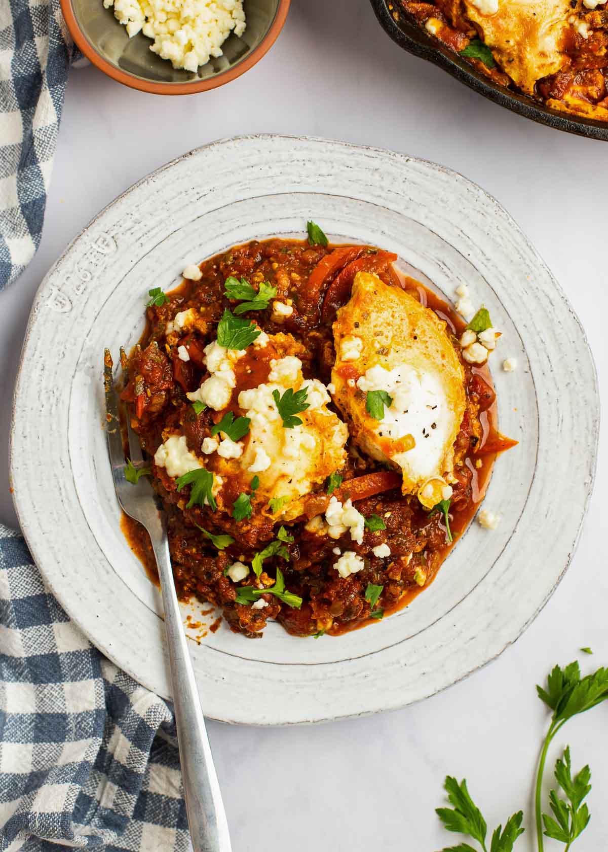 shakshuka on a plate with a fork