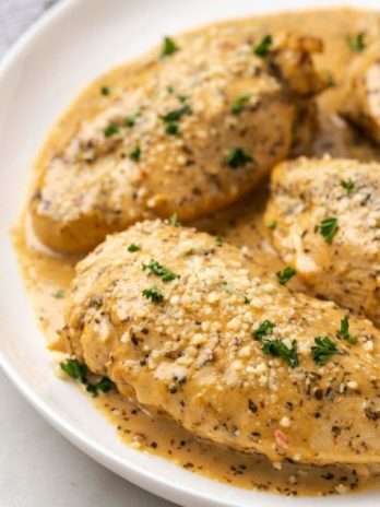 instant pot chicken breast on plate with sauce