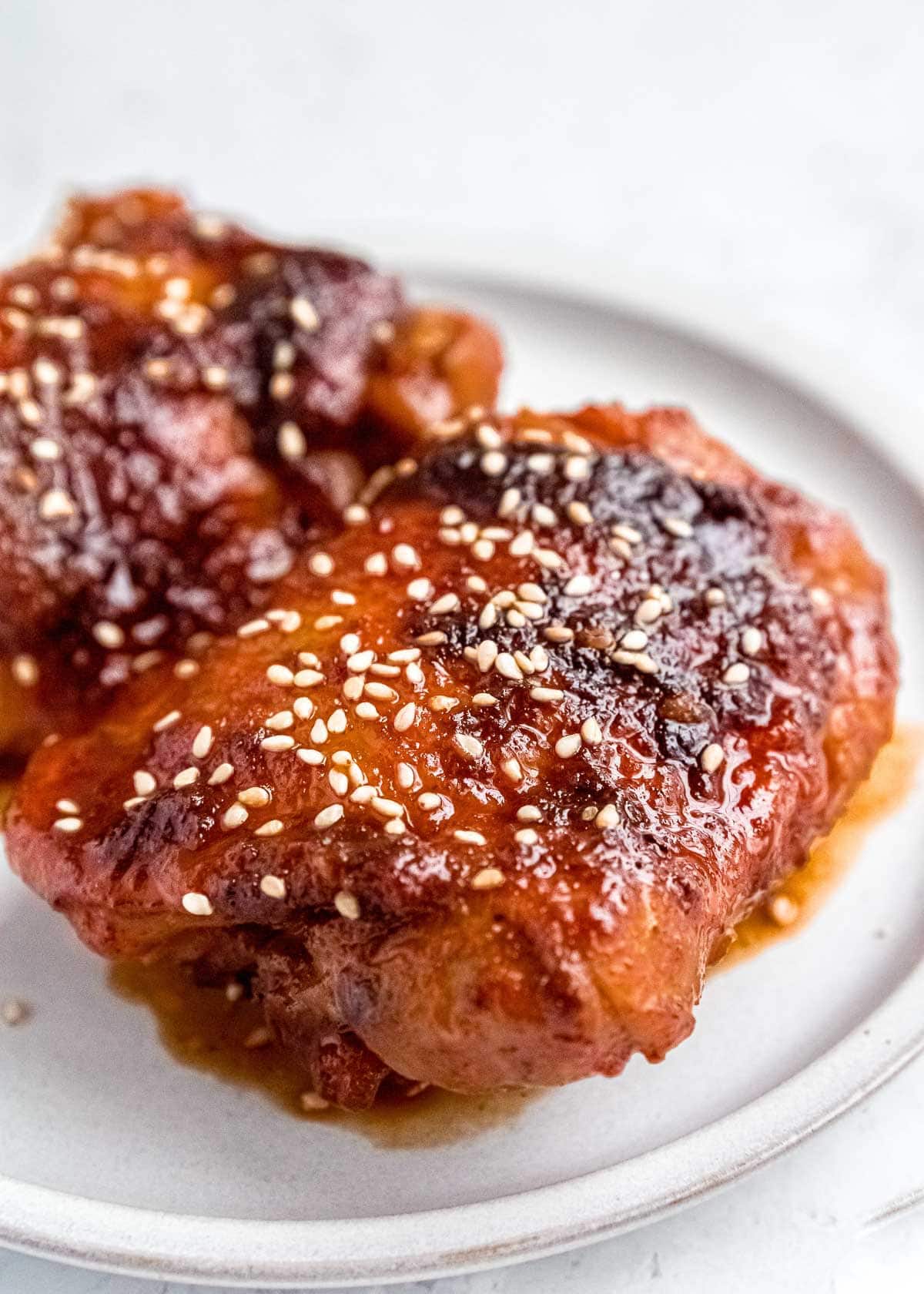 close up shot of asian chicken thighs on a plate