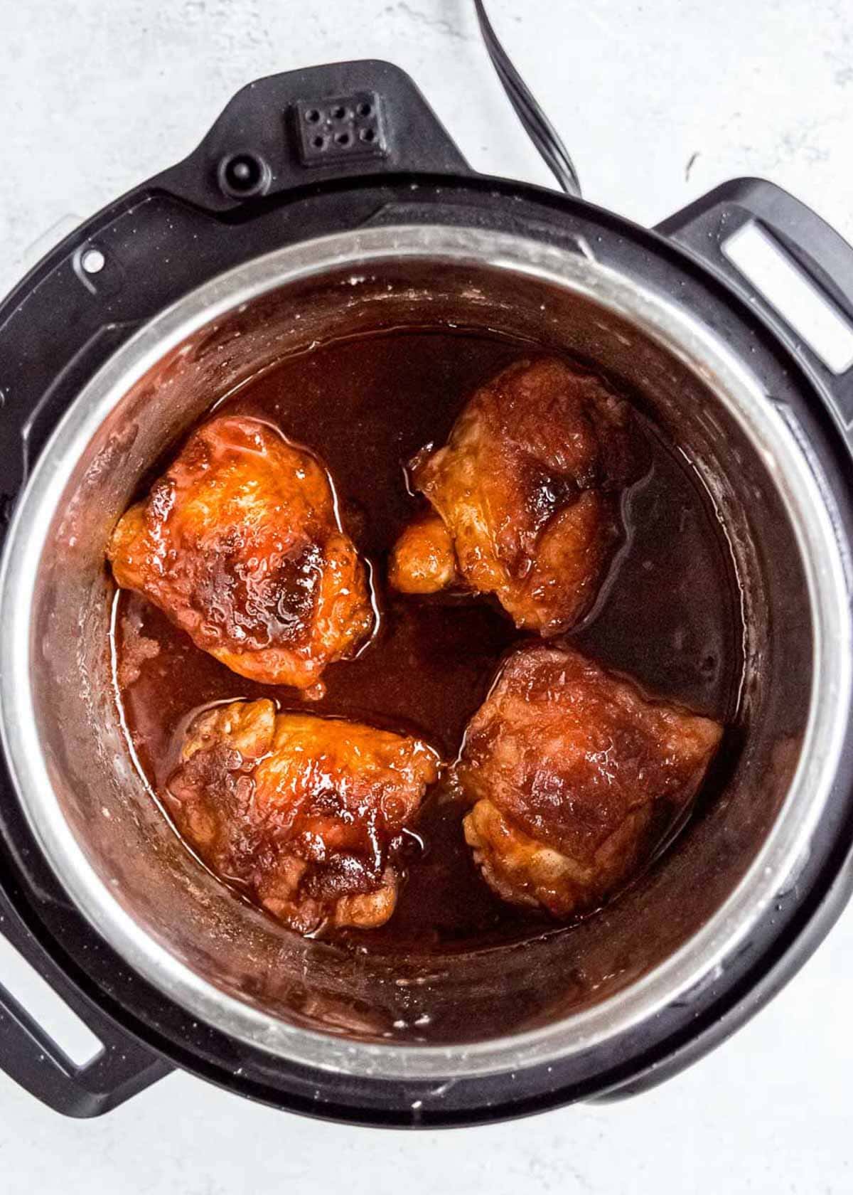 chicken thighs cooked in the instant pot with a sauce