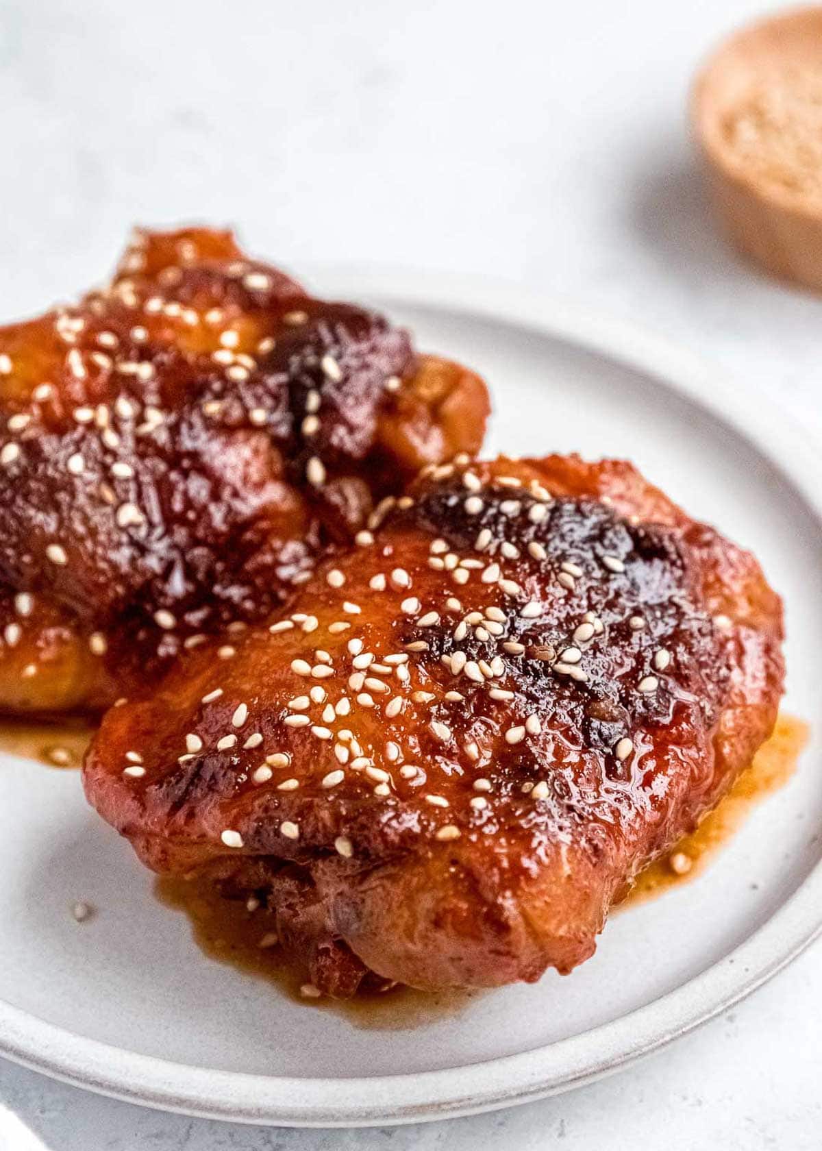 juicy Asian chicken thighs coated in a delicious sesame sauce