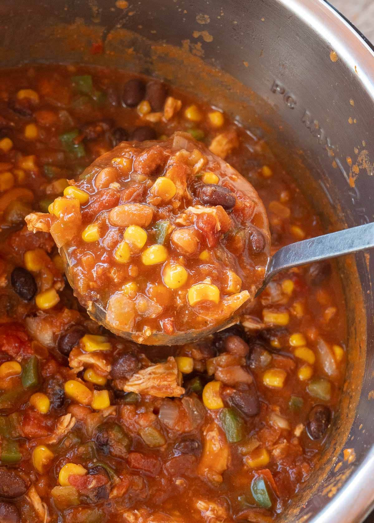 chicken tortilla soup being scooped out of instant pot 