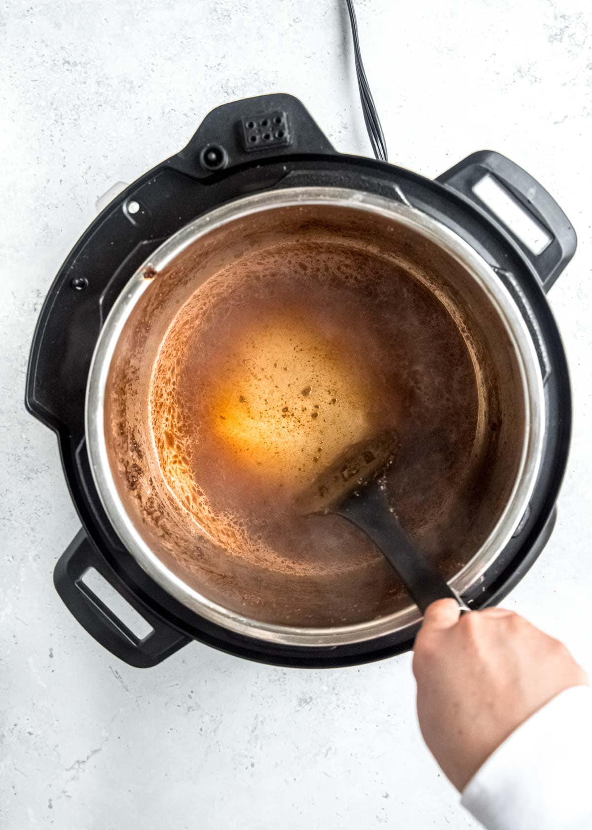 instant pot being deglazed