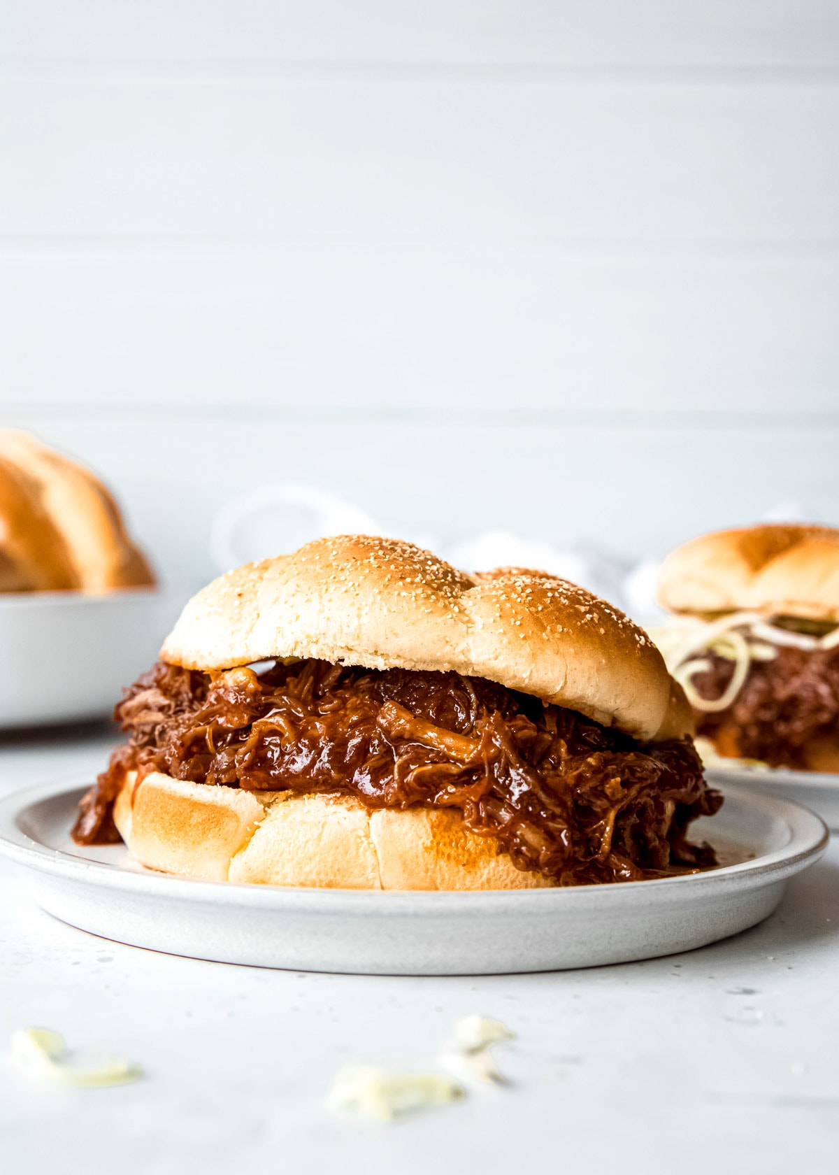 a plate topped with a large bbq sandwich with juicy Instant Pot Pulled Pork