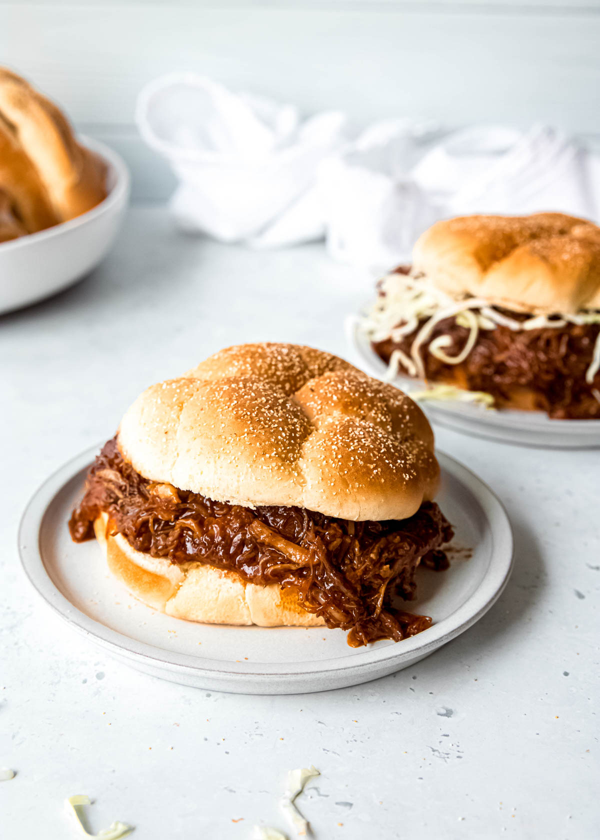 A tender, juicy pulled pork recipe that doesn't require hours to prepare! This Instant Pot Pulled Pork recipe will impress your friends and family without the time and effort required by traditional pulled pork recipes!