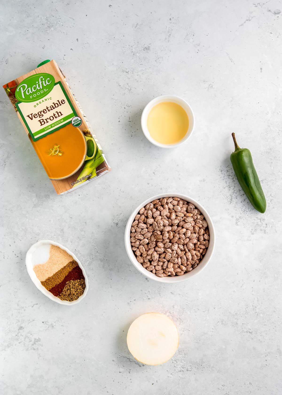 instant pot refried bean ingredients on a white table