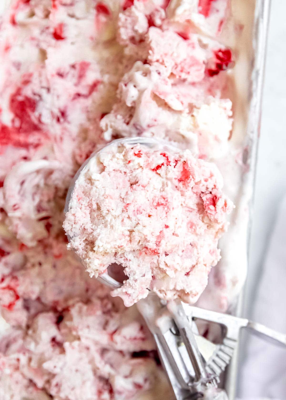 a scoop full of strawberry ice cream