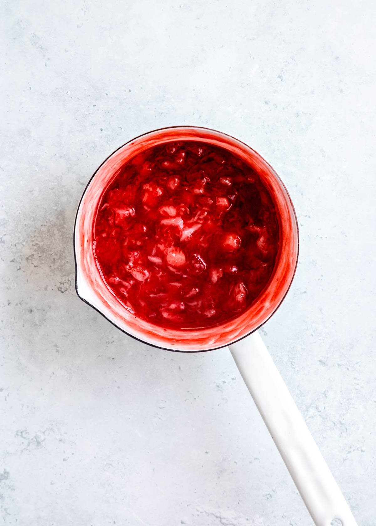 homemade strawberry sauce in a sauce pan