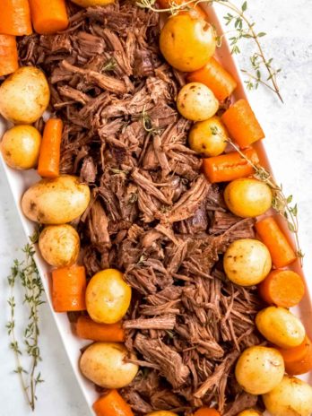 Instant Pot Pot Roast on a plate with potatoes and carrots