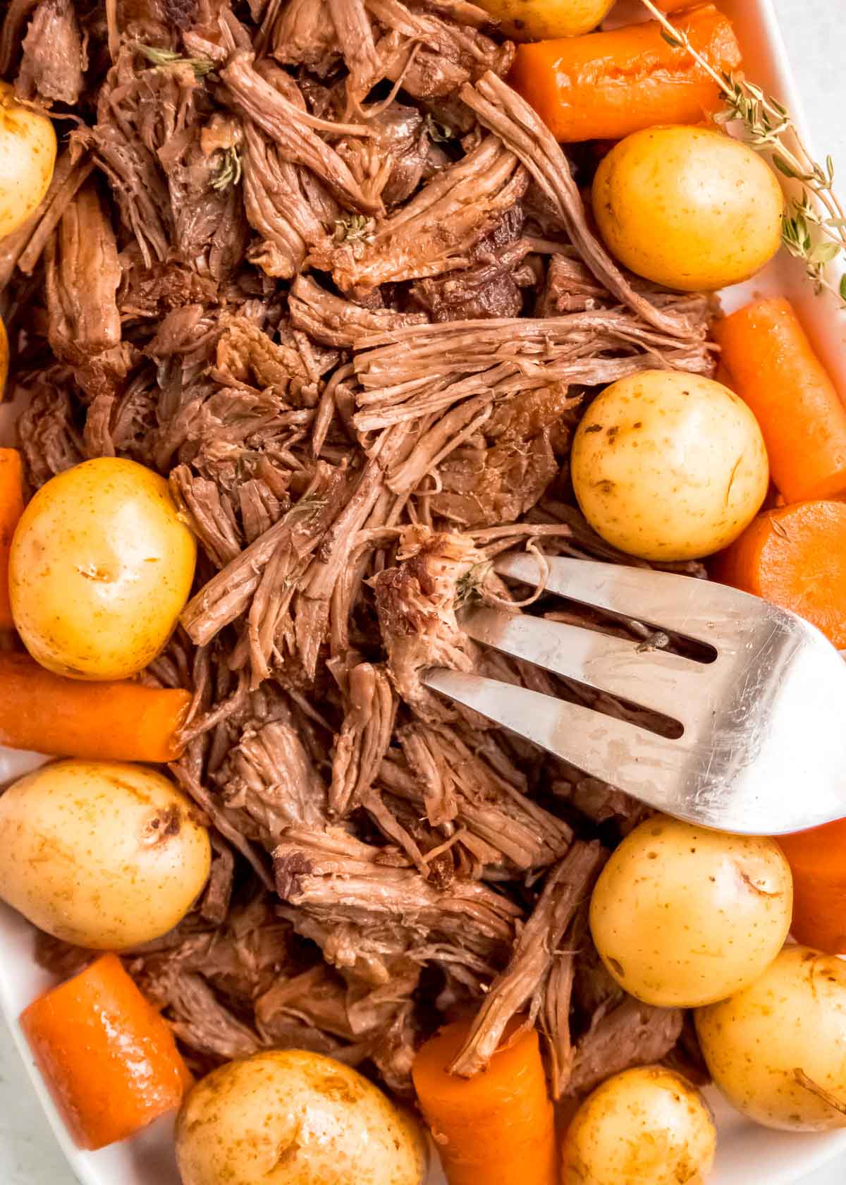 shredded pot roast with potatoes and carrots