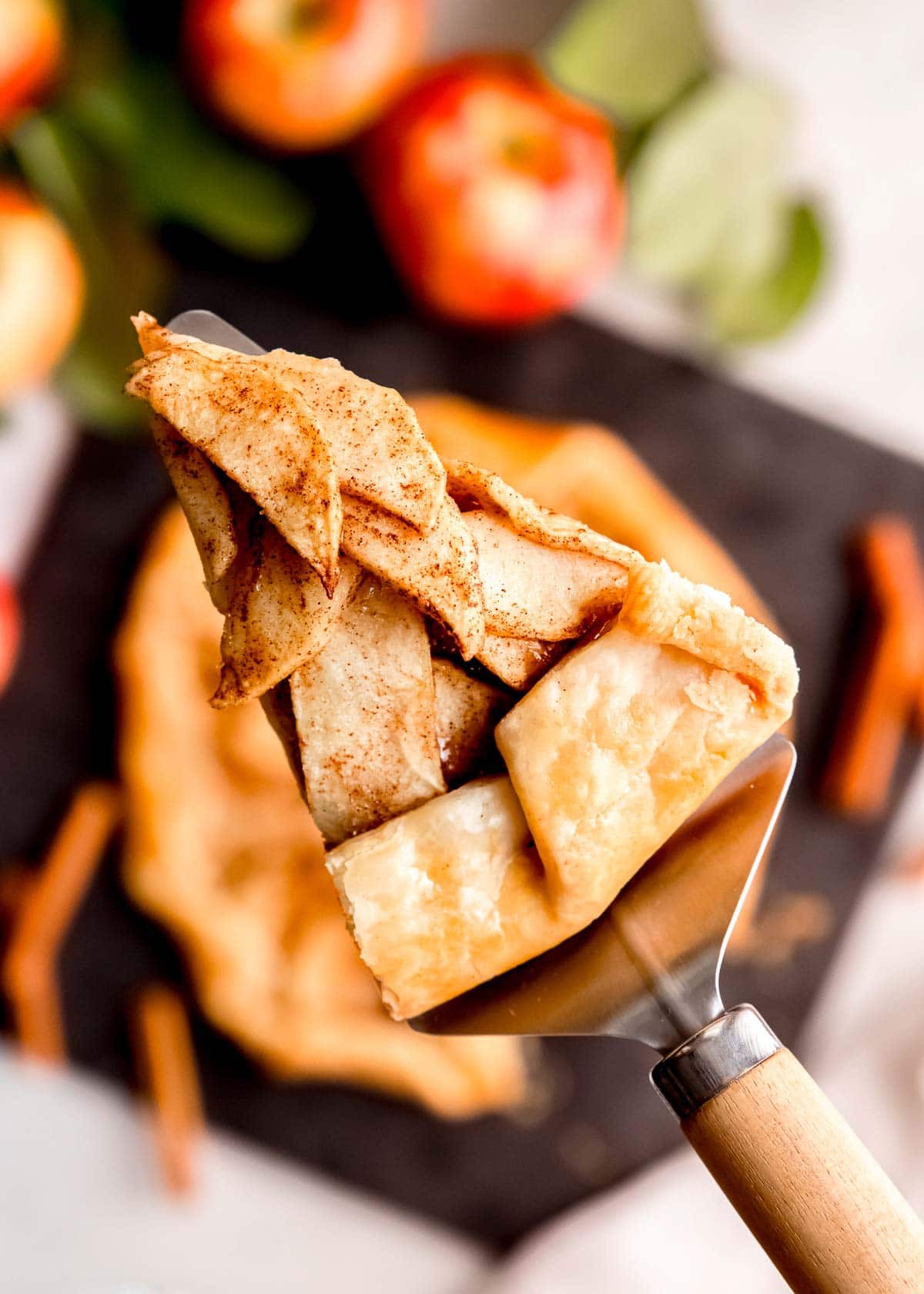 a slice of apple galette on a serving spatula