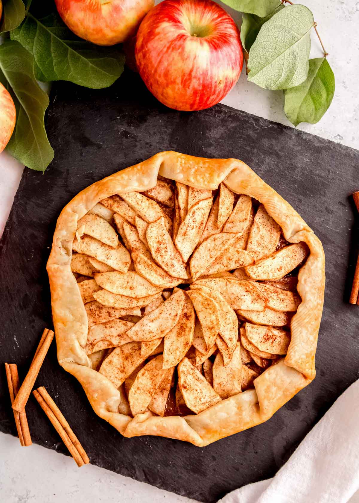 baked apple galette on slate serving board