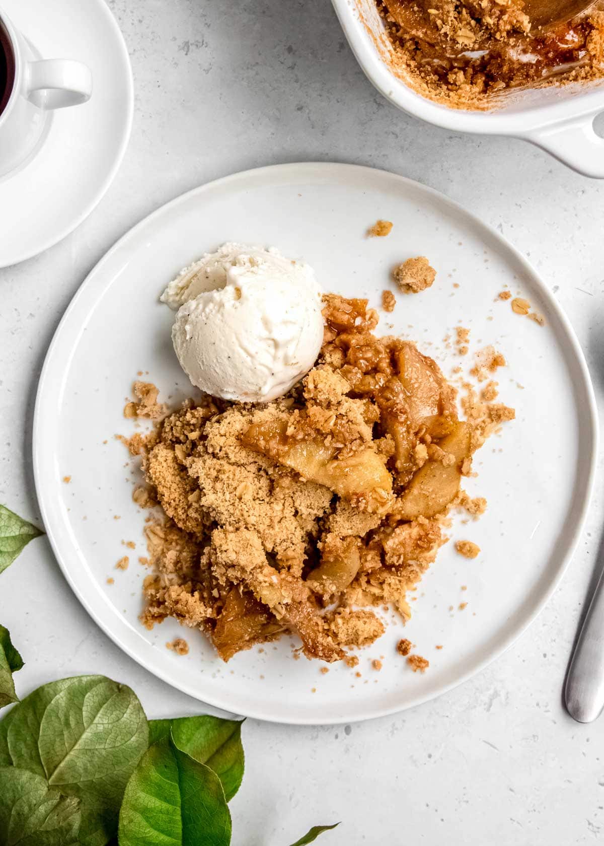 apple crumble on plate with ice cream