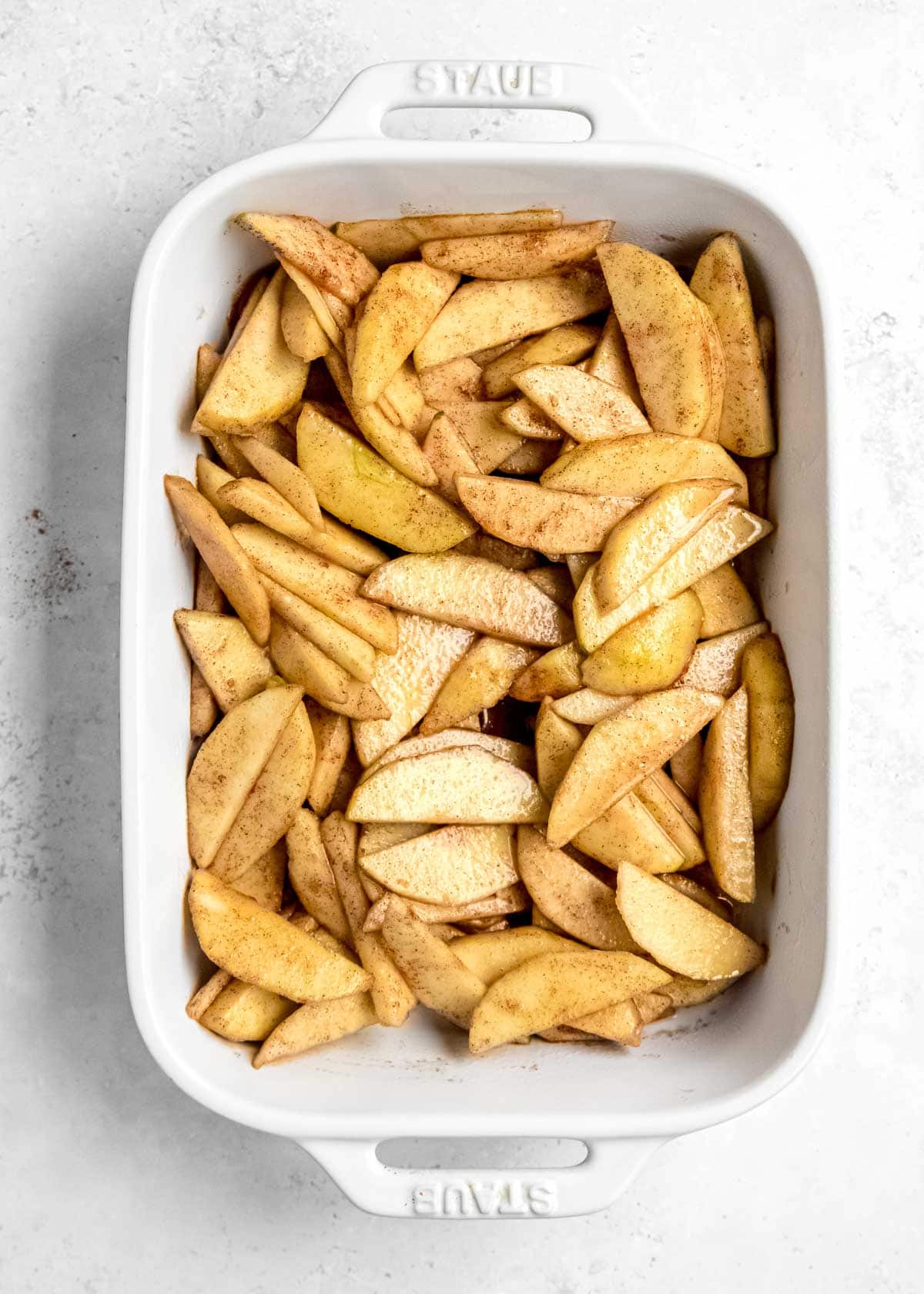 seasoned apples in a casserole dish