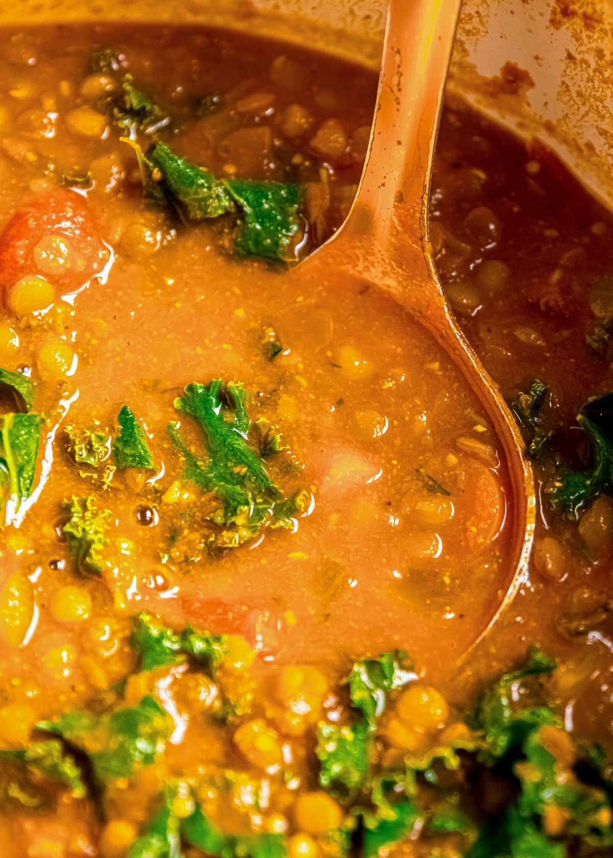 close up shot of lentil soup being stirred