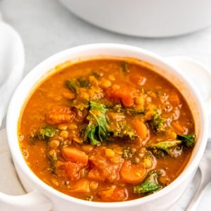 lentil soup in white bowl on white table