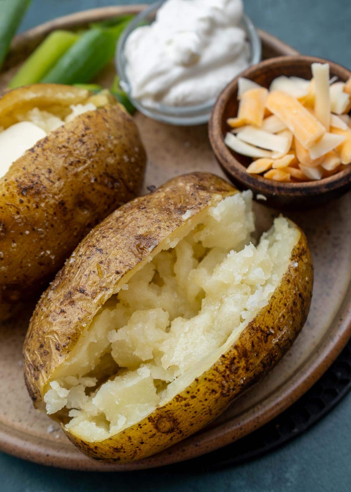 sliced baked potatoes on brown plate