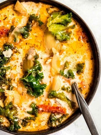 tuscan chicken soup in a black bowl