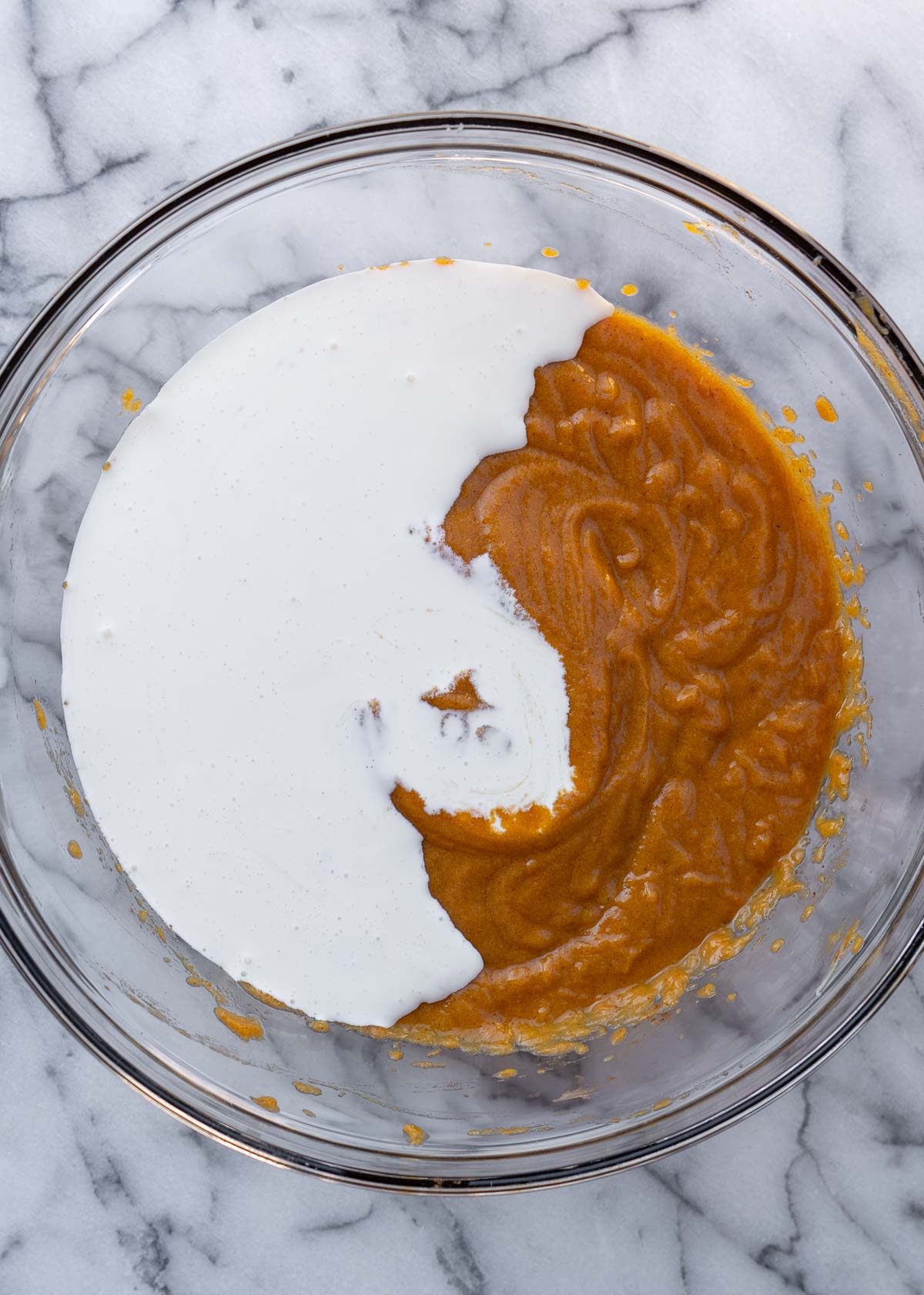 pumpkin pie filling and heavy cream in a bowl