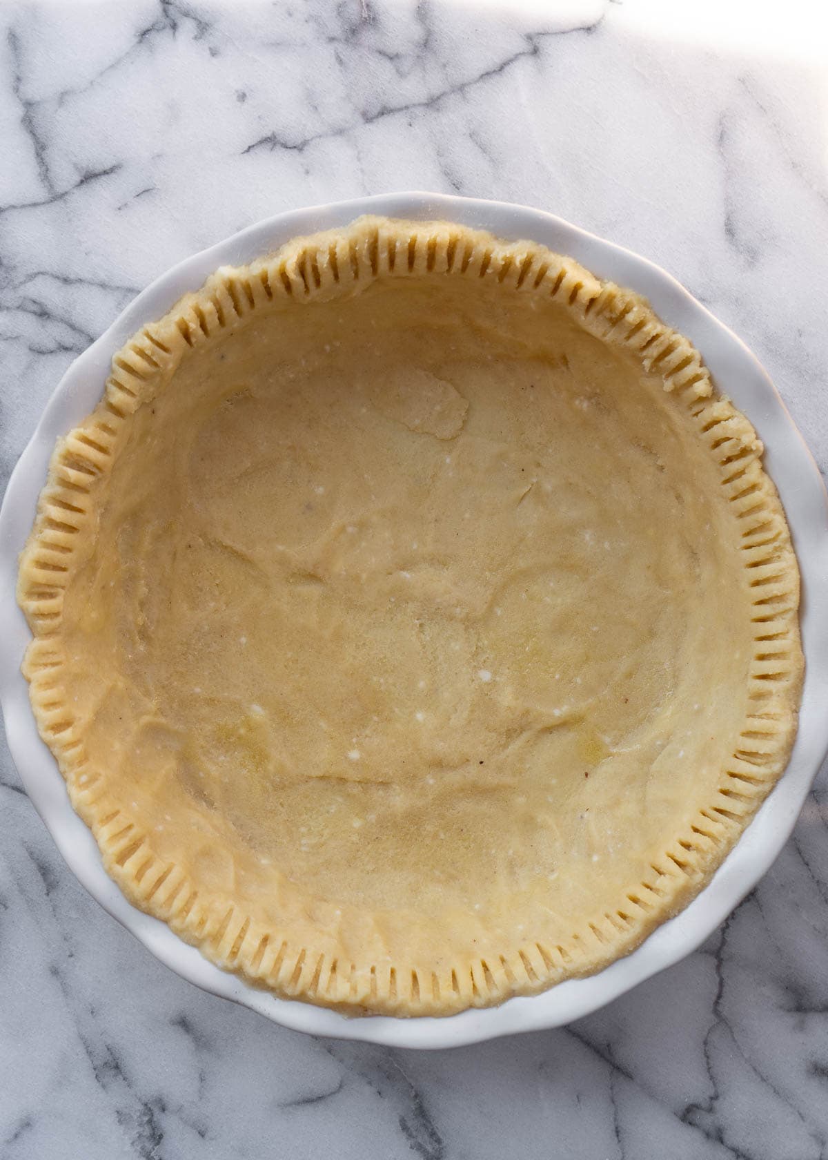 unbaked pie crust in a pan