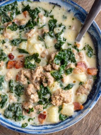 a bowl of spinach, turnip, and sausage soup (zuppa toscana recipe)