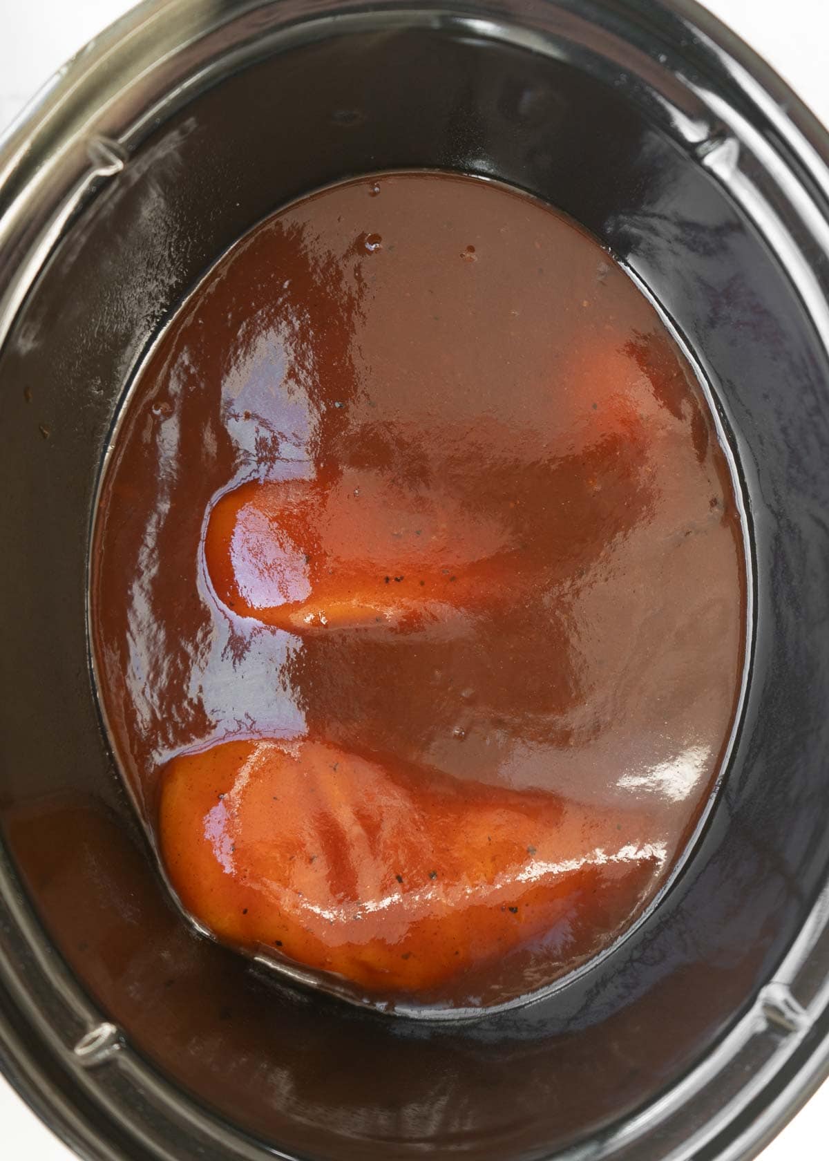 chicken smothered in bbq sauce in crockpot